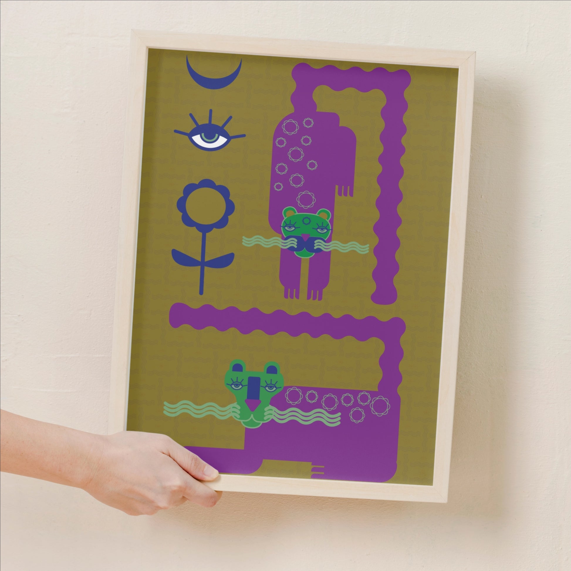 a-persons-hand-holding-out-a-framed-print-of-magical-snowcats-fine-art-print-purple-mustard-mystical-animal-wall-art-gail-evenden-against-a-beige-wall